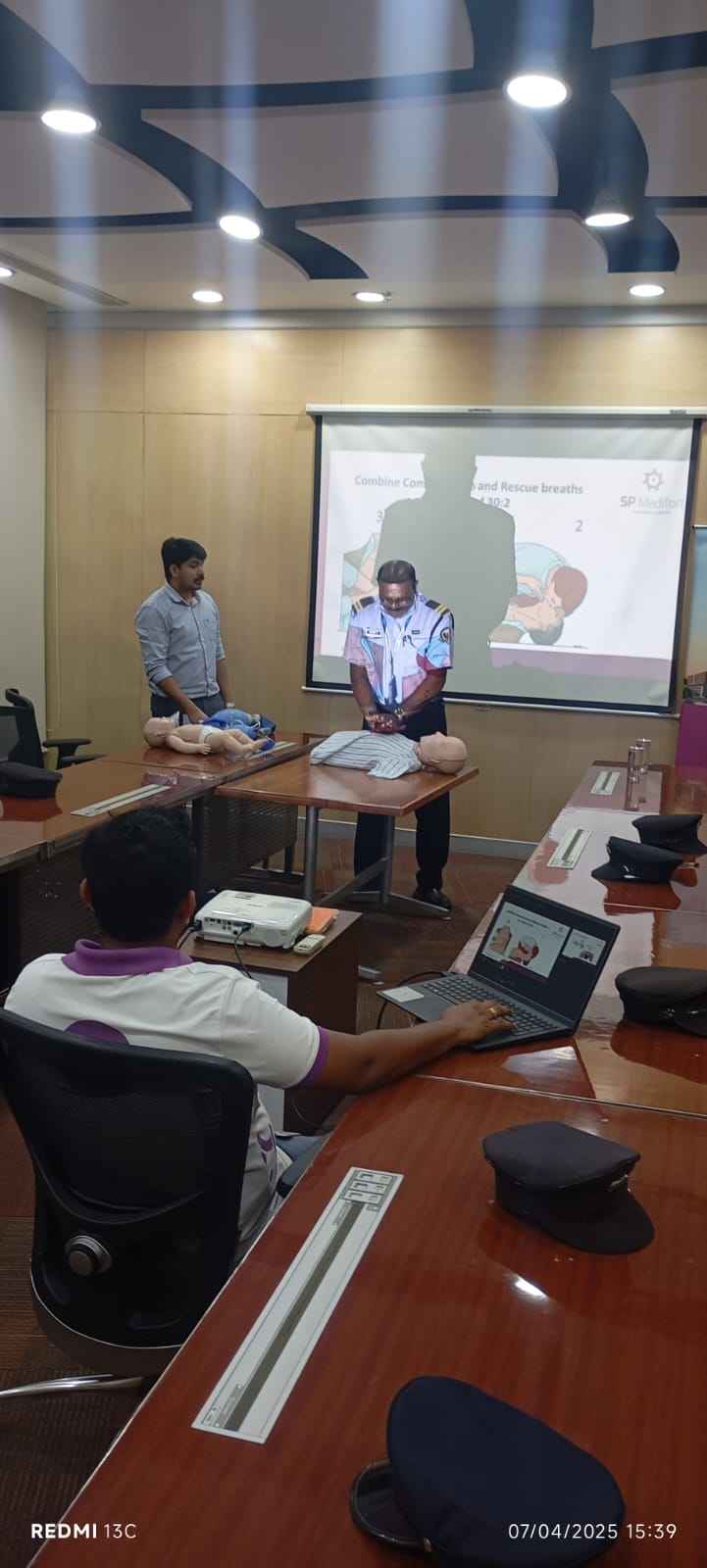 An employee attempting to provide CPR.
