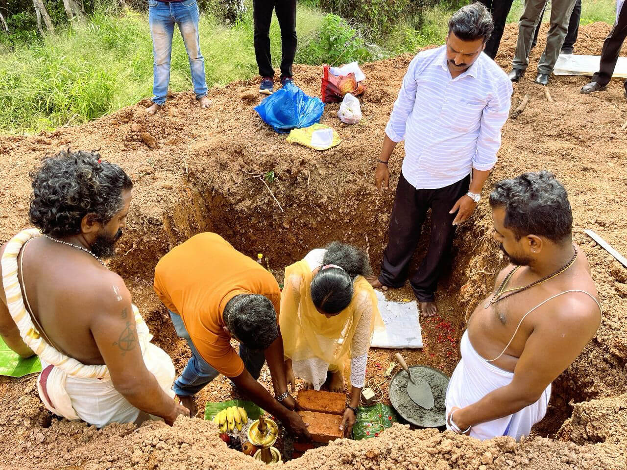 Technopark employees laying foundation stone.