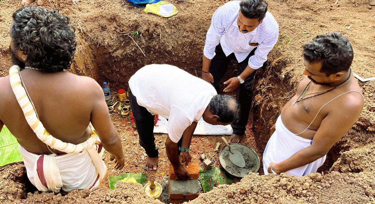Technopark employees laying foundation stone.