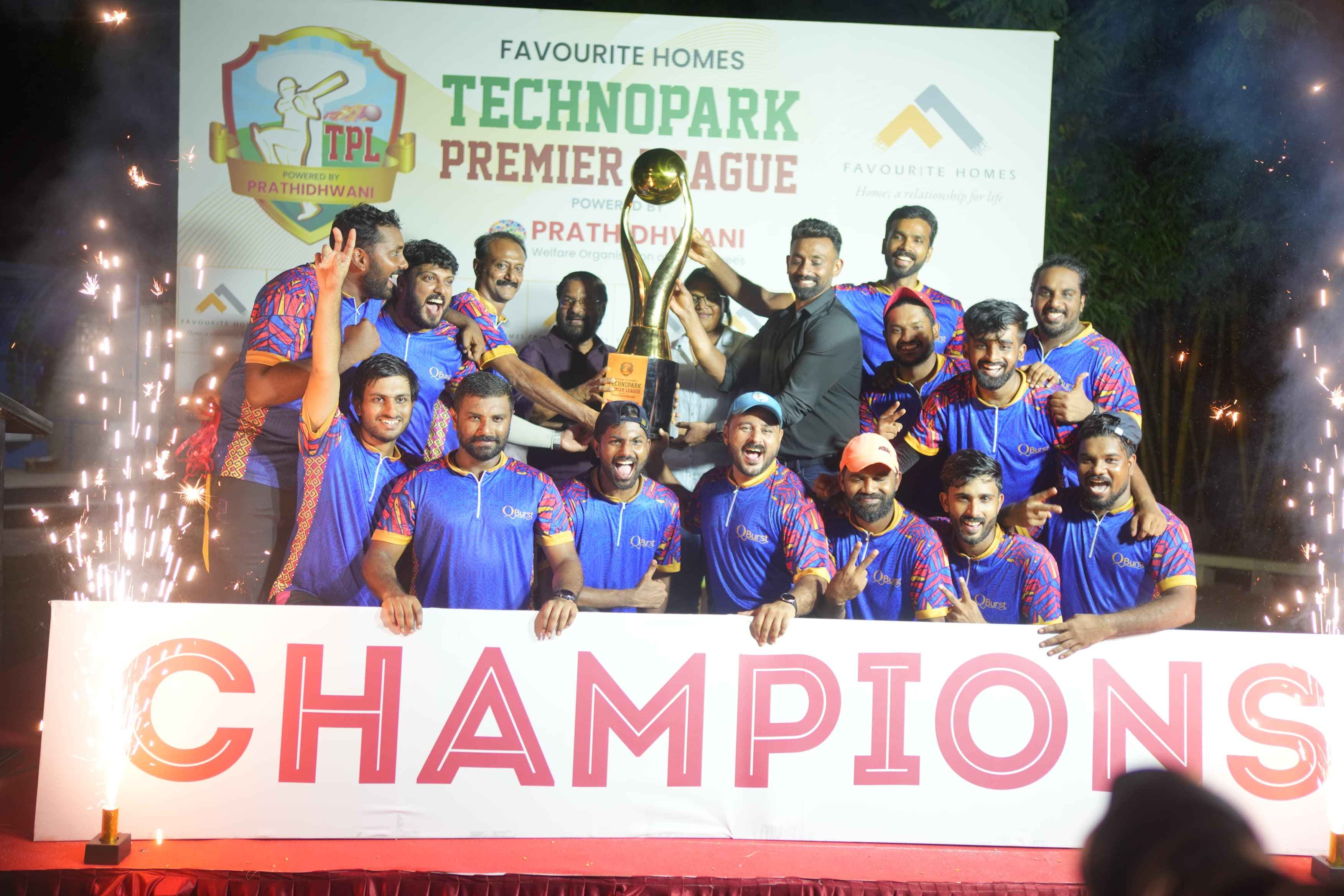 The QBurst Team, champions of the Favourite Homes Technopark Premier League Tournament, holding the winning trophy.