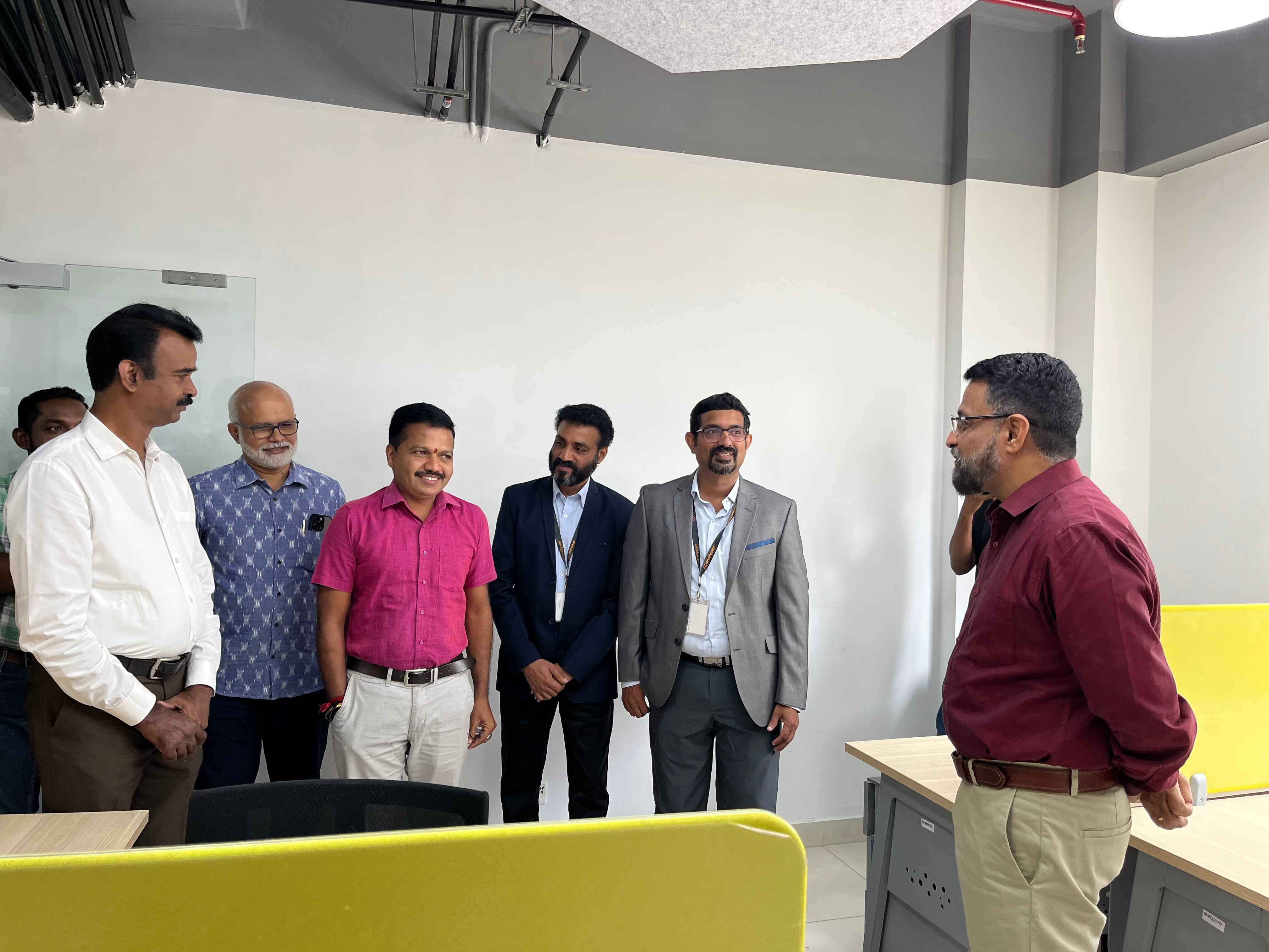 CEO Technopark sharing a light moment with Team Analystor Technologies and other guests.