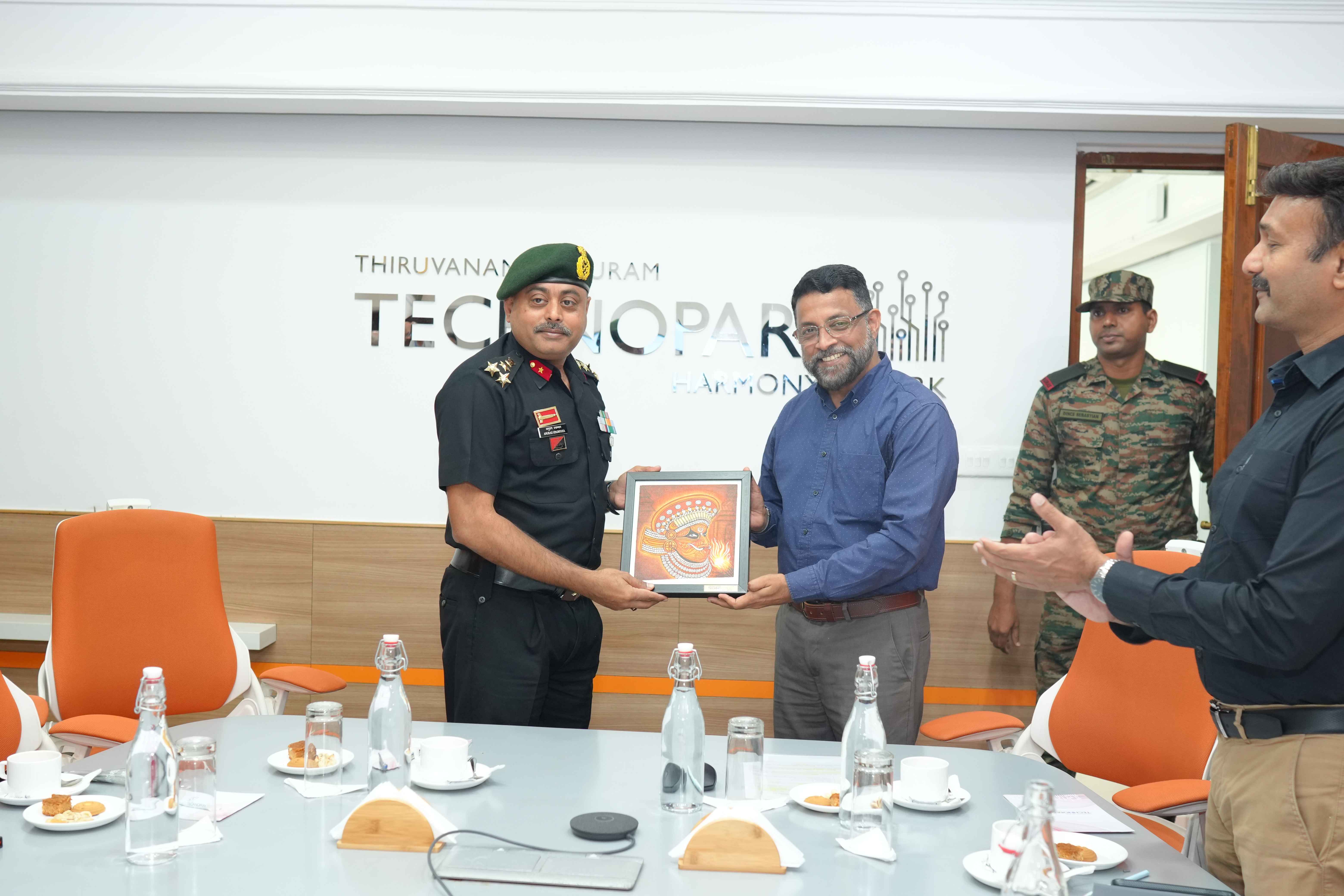 Brigadier Anurag Upadhyaya receiving a token of gratitude from Col Sanjeev Nair (Retd), CEO Technopark.