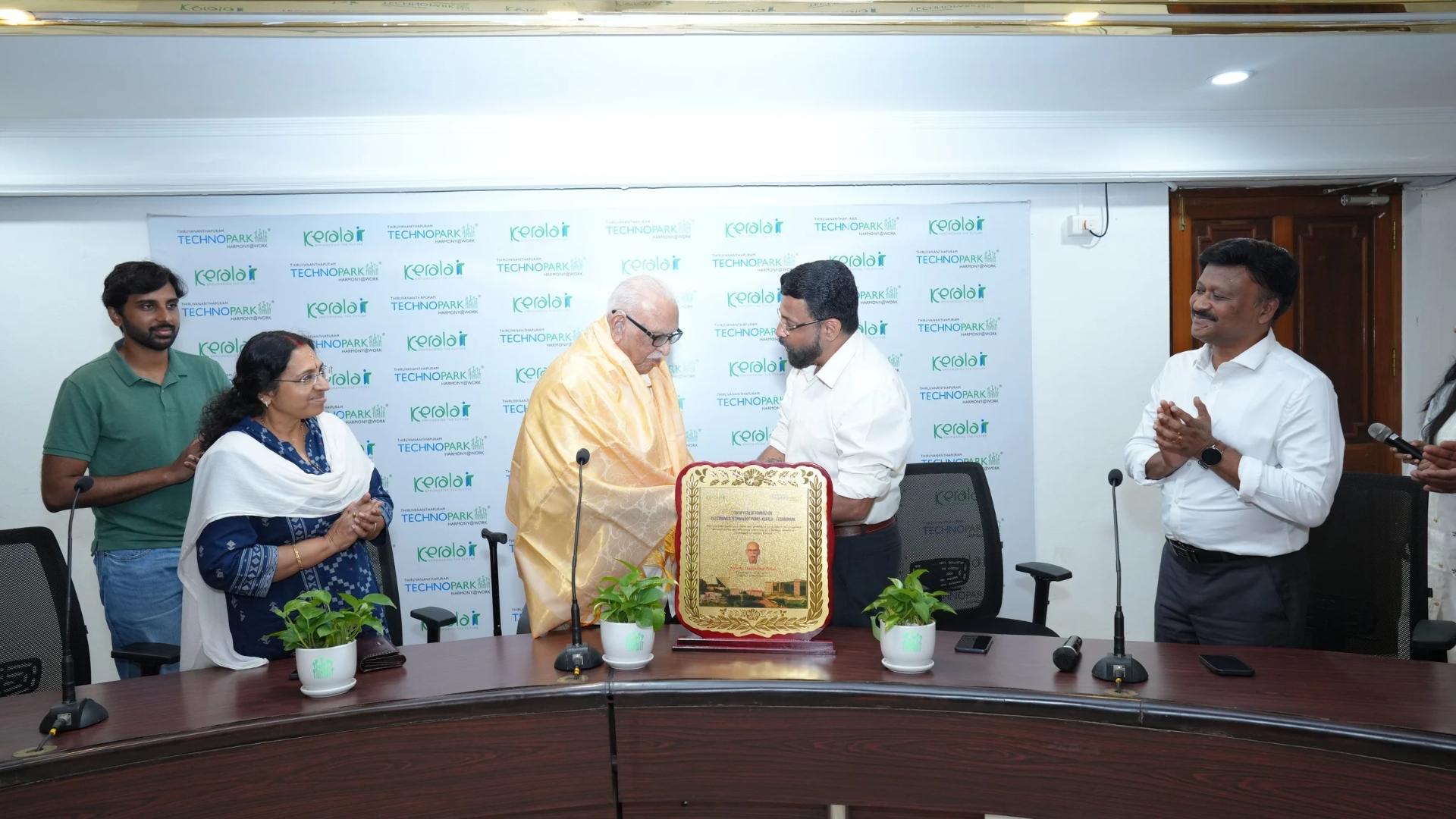 Shri Pillai being adorned with a ponnada by Col Sanjeev Nair (Retd), CEO Technopark.