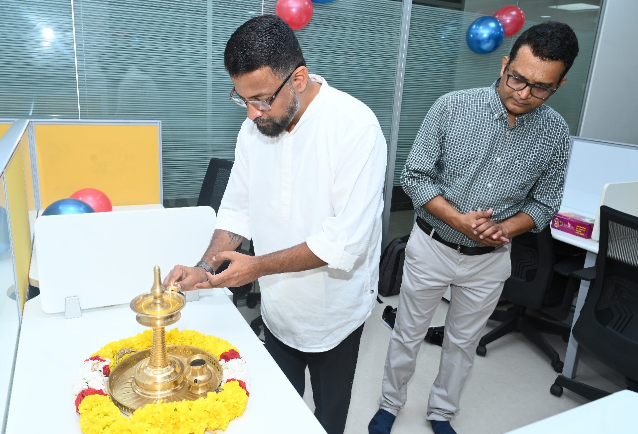 Lighting the auspicious lamp to signify the launch.